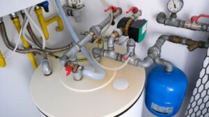 Old hot water tank showing signs of corrosion in Vancouver home