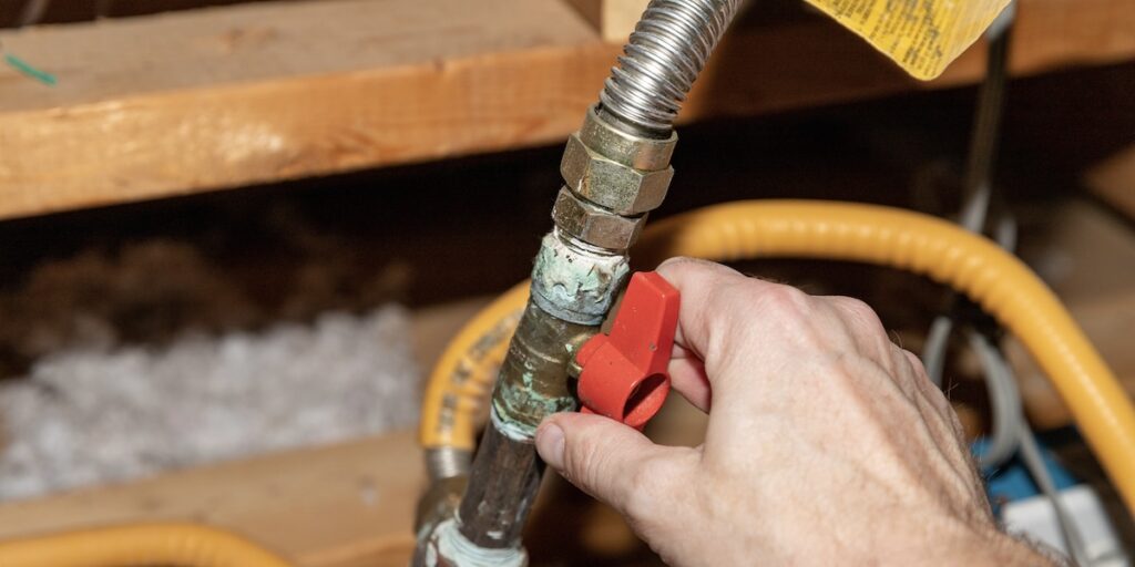 Licensed plumber performing safe gas line repair in Vancouver